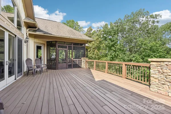 a view of a house with wooden deck