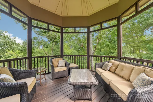 a balcony with furniture and outdoor view