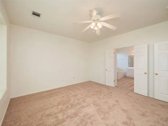 a bathroom with a double vanity sink a mirror and a bathtub