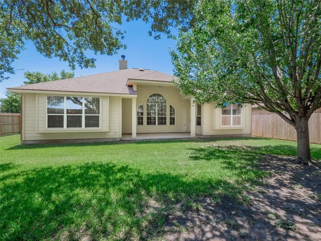 a house with trees in front of it
