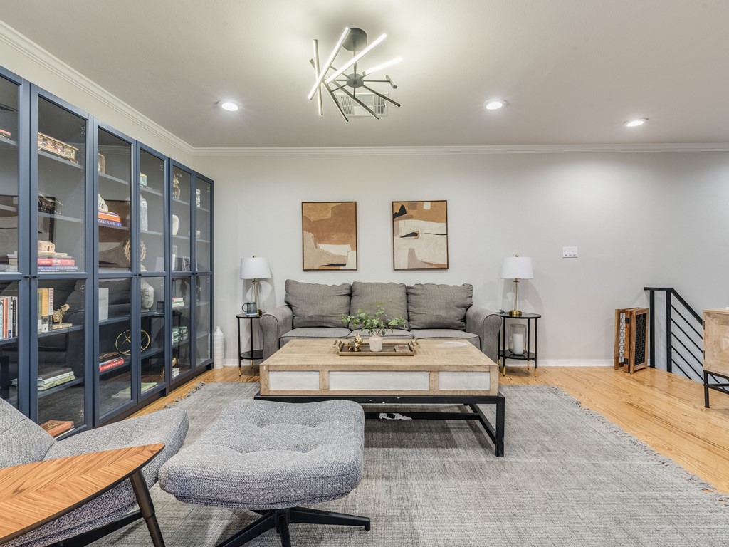 500 East Riverside Drive, Unit 206 Austin, TX 78704 - Photo 13 of 32 Living room featuring crown molding, wood finished floors, and recessed lighting