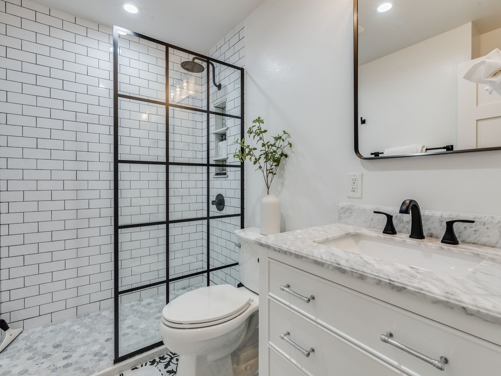 500 East Riverside Drive, Unit 206 Austin, TX 78704 - Photo 16 of 32 Full bathroom with vanity, walk in shower, and recessed lighting