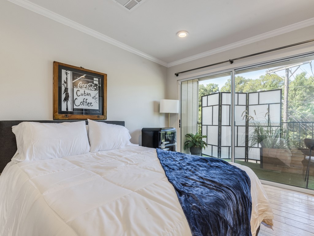 500 East Riverside Drive, Unit 206 Austin, TX 78704 - Photo 19 of 32 Bedroom featuring access to outside, ornamental molding, light wood-style floors, and recessed lighting