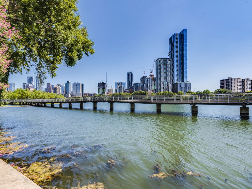 500 East Riverside Drive, Unit 206 Austin, TX 78704 - Photo 2 of 32 Water view featuring skyline and a notable bridge