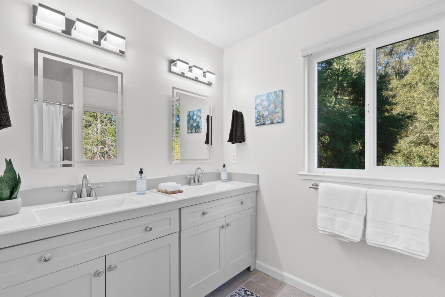 270 Carrera Circle Aptos, CA 95003 - Photo 21 of 42 a bathroom with 2 sink tub and a mirror