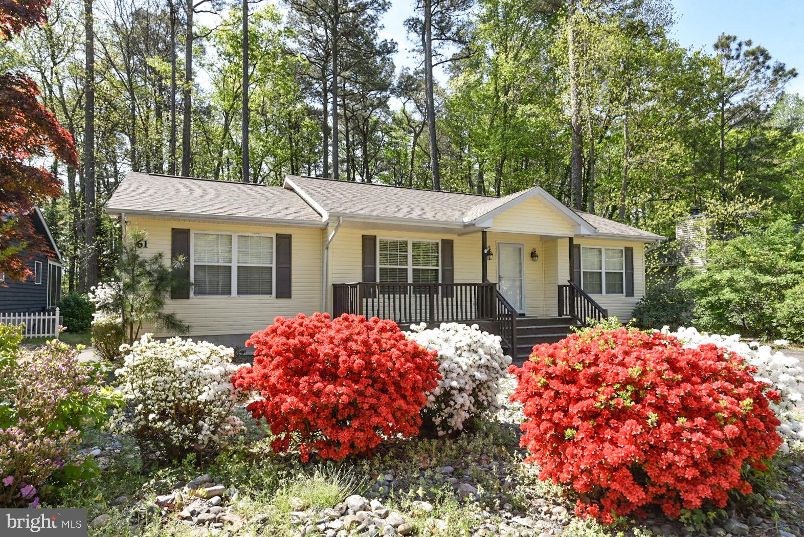 61 Abbyshire Road Ocean Pines, MD 21811 - Photo 1 of 40 a front view of a house with a garden