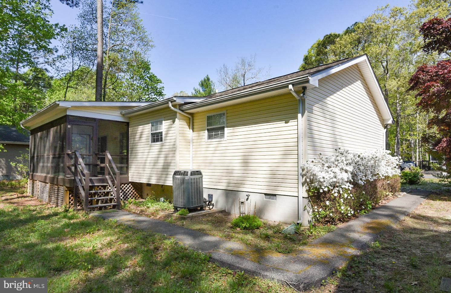 61 Abbyshire Road Ocean Pines, MD 21811 - Photo 23 of 40 a view of a house with a yard and potted plants