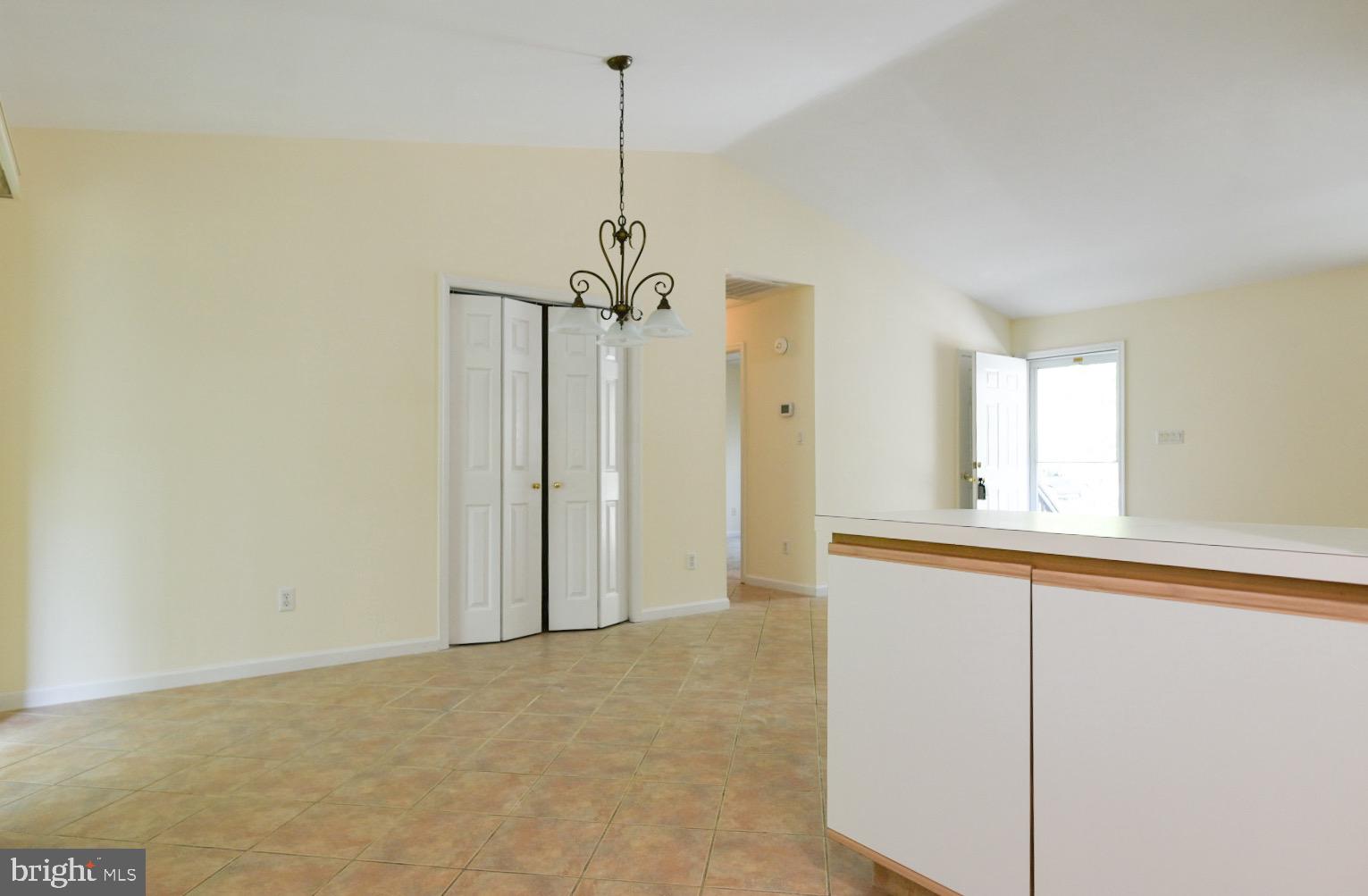 61 Abbyshire Road Ocean Pines, MD 21811 - Photo 29 of 40 a view of empty room with window and chandelier fan