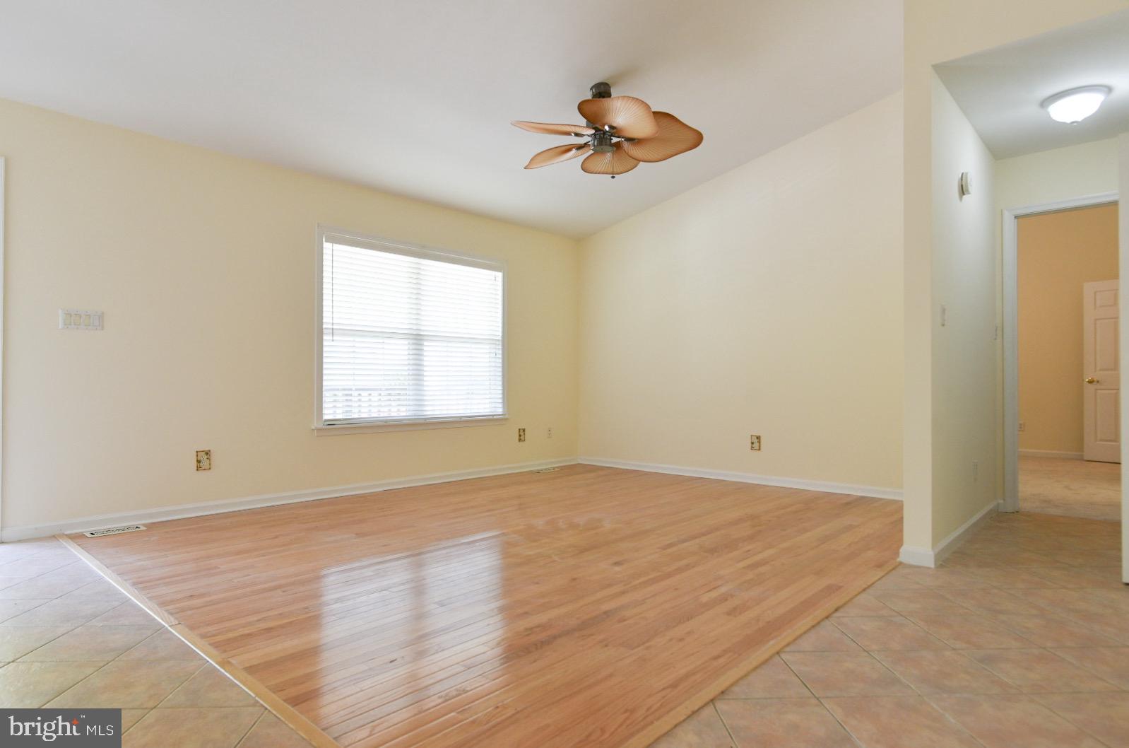 61 Abbyshire Road Ocean Pines, MD 21811 - Photo 30 of 40 wooden floor in an empty room with a window