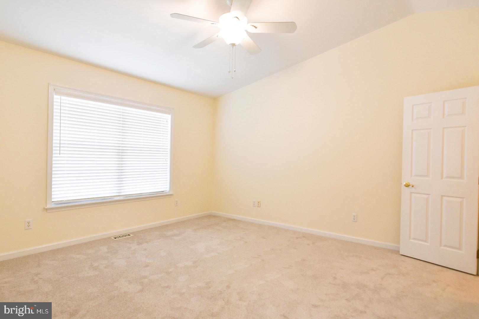 61 Abbyshire Road Ocean Pines, MD 21811 - Photo 5 of 40 an empty room with a window and a fan