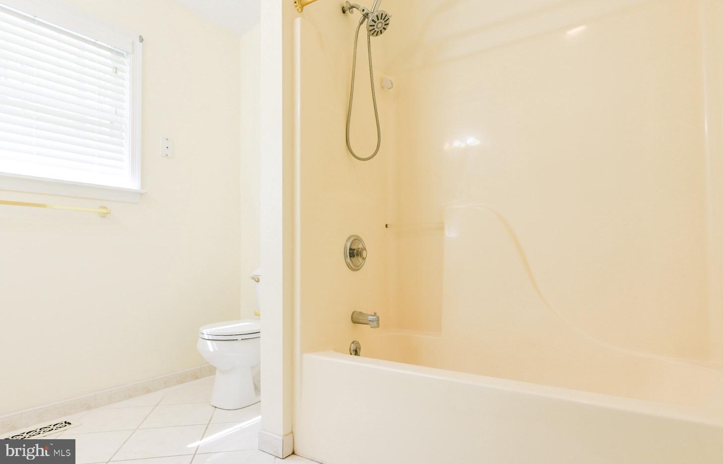 61 Abbyshire Road Ocean Pines, MD 21811 - Photo 10 of 40 a bathroom with a toilet and a bathtub