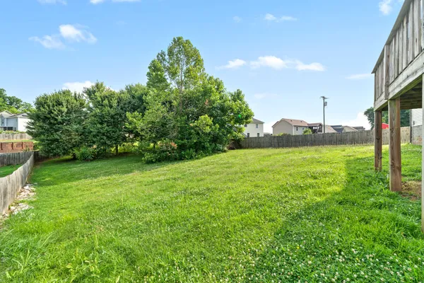 a view of a garden with a building in the background