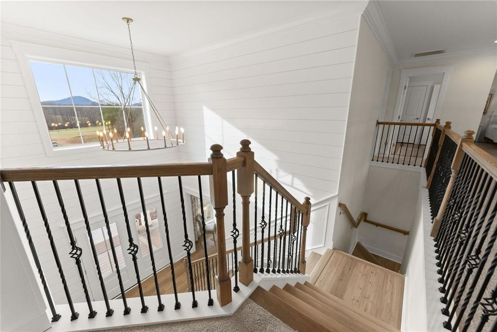 6998 Britt Gailey Road Clermont, GA 30527 - Photo 56 of 92 a view of staircase with railing and white walls