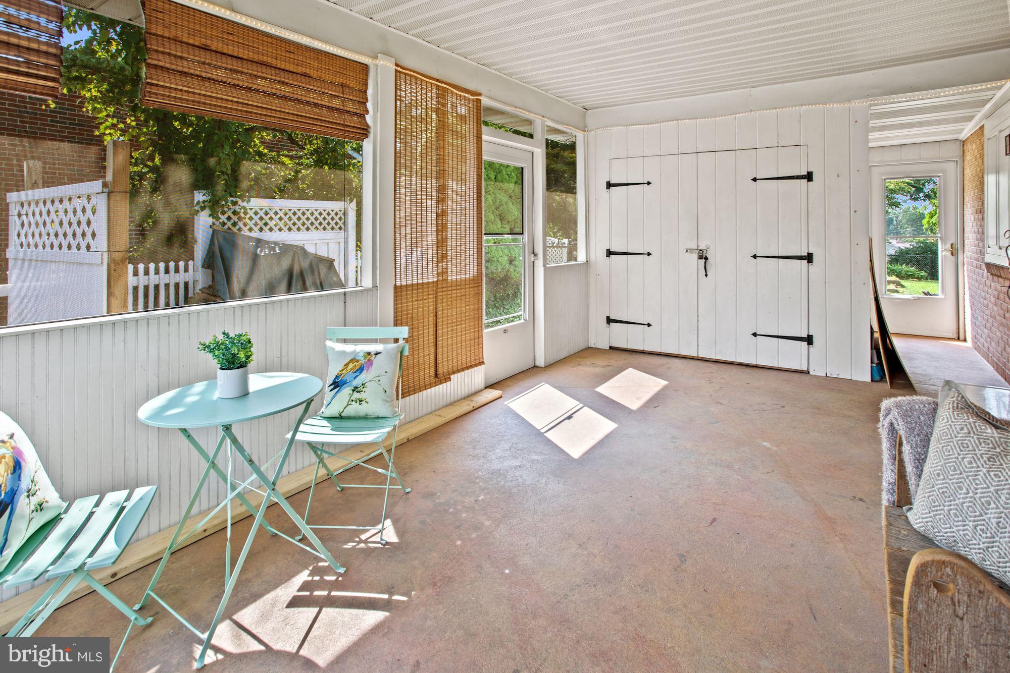 17909 Pin Oak Road Hagerstown, MD 21740 - Photo 17 of 21 Screened-in porch and exit door to backyard