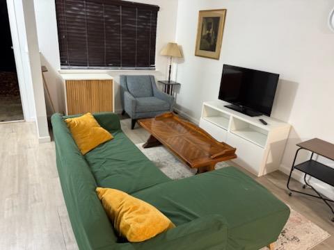 19223 Salvador Court, Unit C Groveland, CA 95321 - Photo 7 of 10 a living room with furniture and a flat screen tv