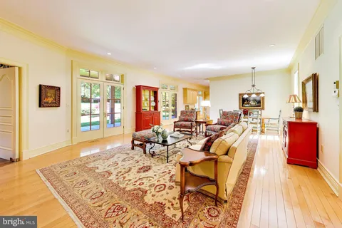 a view of a hallway view with wooden floor and staircase