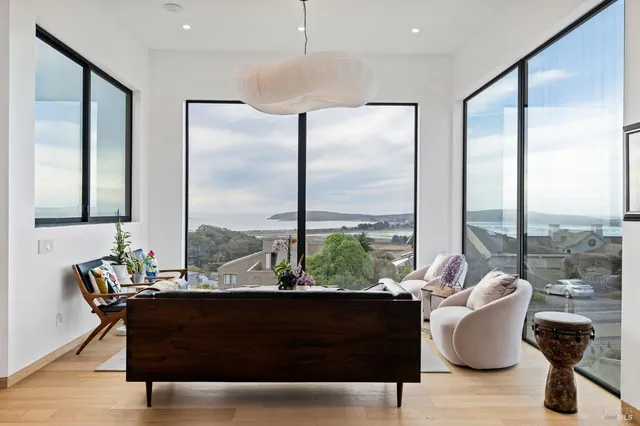 a spacious bedroom with a bed and a large window