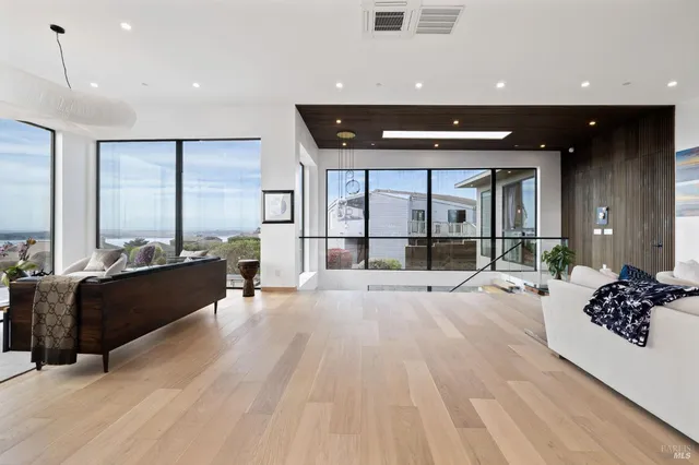 a spacious bathroom with a granite countertop sink and a mirror