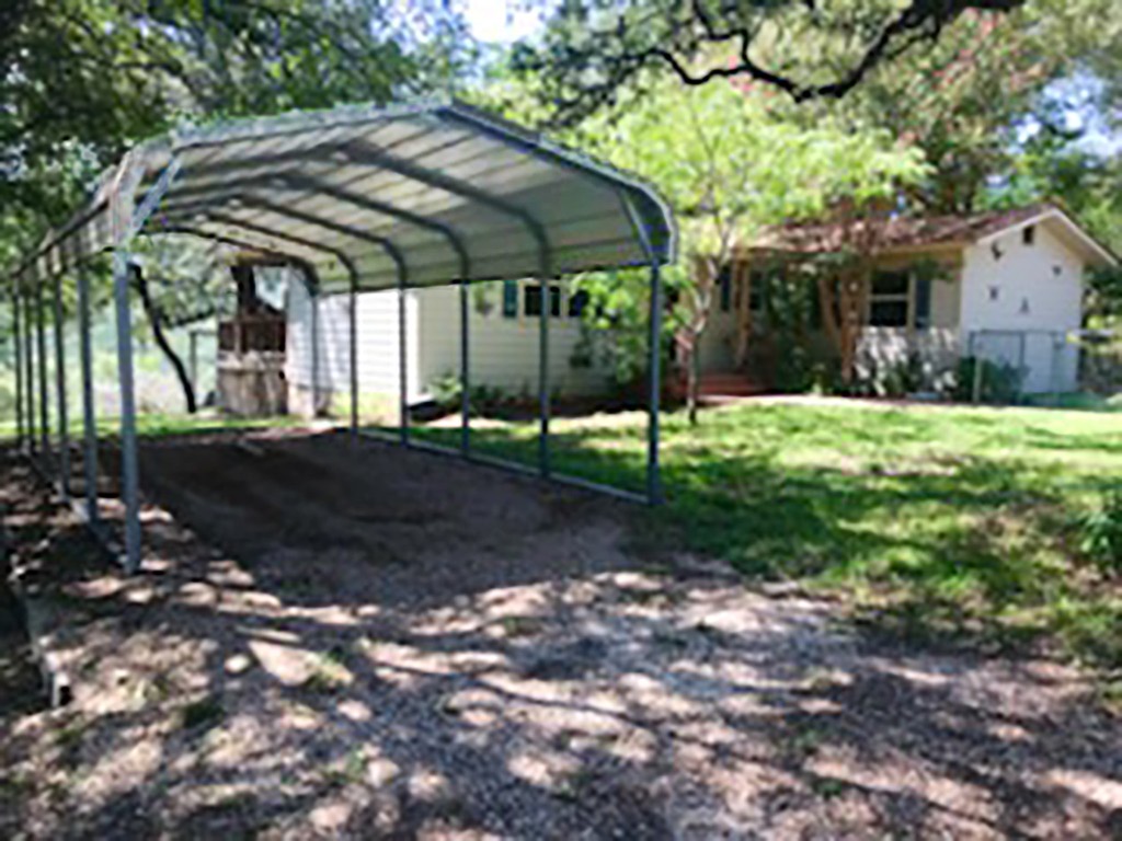 18111 Gregg Bluff Road Jonestown, TX 78645 - Photo 14 of 19 Large, Metal Carport to protect your cars from the sun