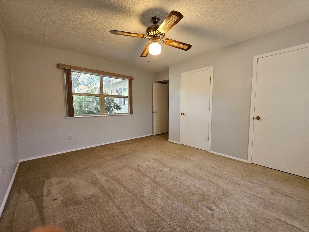 18111 Gregg Bluff Road Jonestown, TX 78645 - Photo 10 of 19 Second Bedroom - Two Closets Offer Lots of Storage
