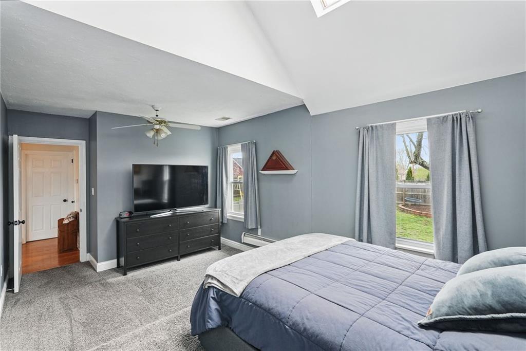 3305 Harding Avenue Aliquippa, PA 15001 - Photo 16 of 40 a bedroom with a bed and a flat tv screen on dresser