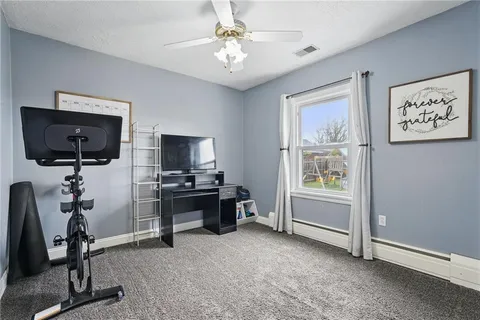 a view of a livingroom with furniture and a flat screen tv
