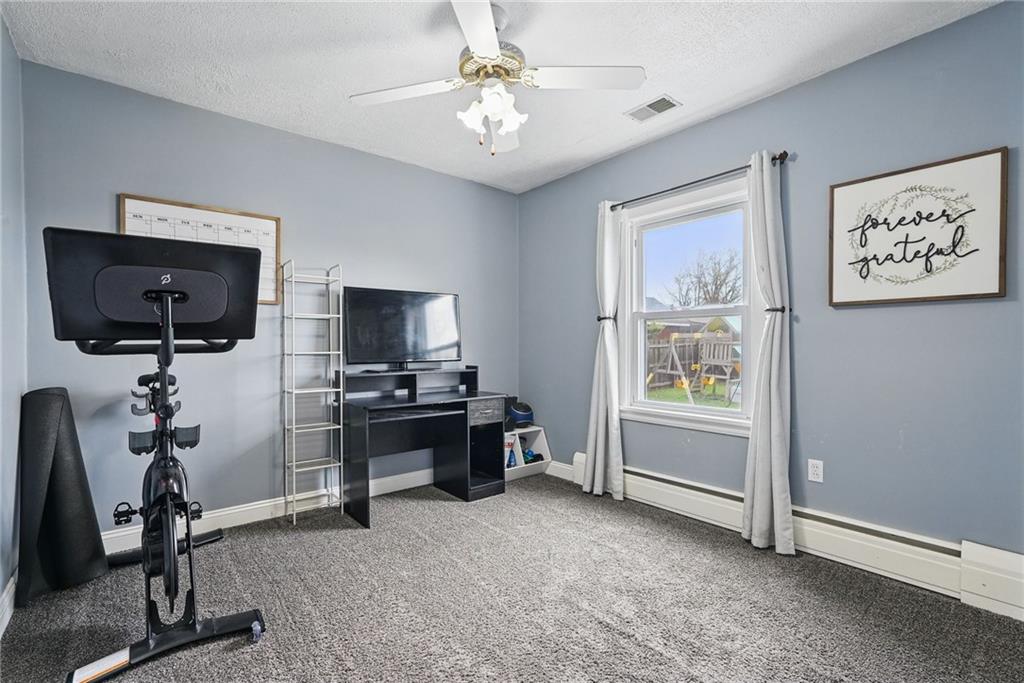 3305 Harding Avenue Aliquippa, PA 15001 - Photo 20 of 40 a view of a livingroom with furniture and a flat screen tv
