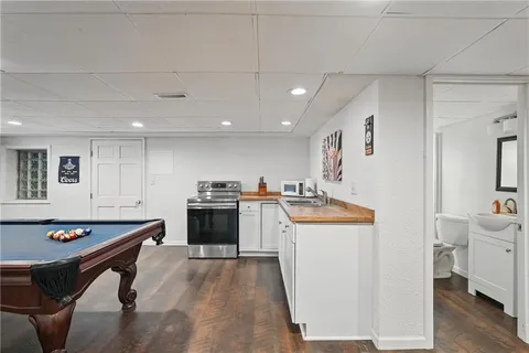a kitchen that has a sink and a stove in it