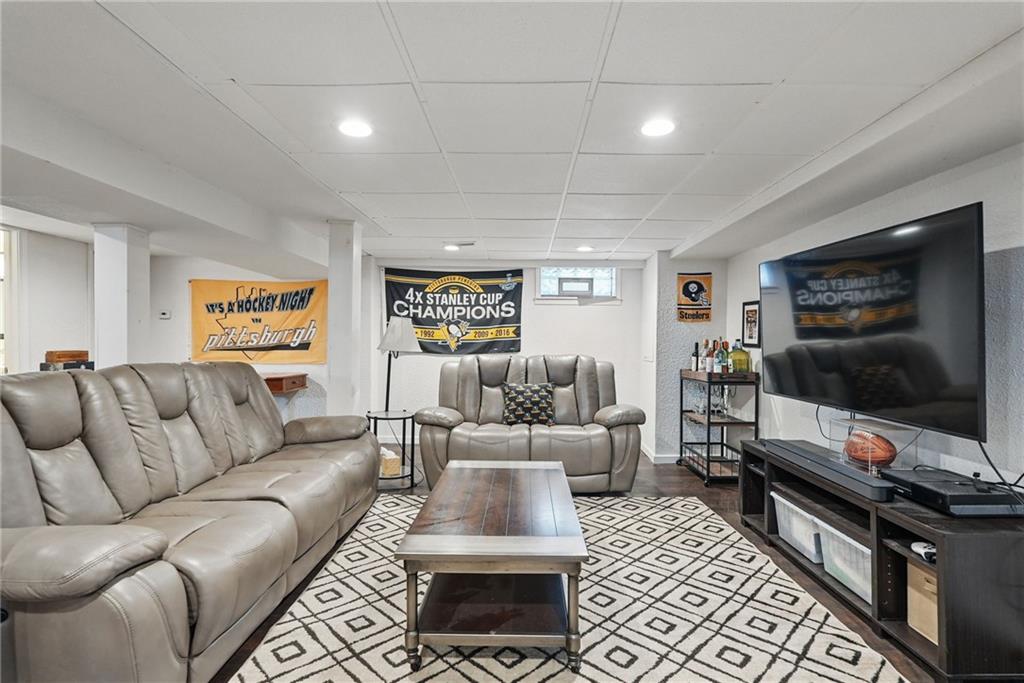 3305 Harding Avenue Aliquippa, PA 15001 - Photo 29 of 40 a living room with furniture and a flat screen tv
