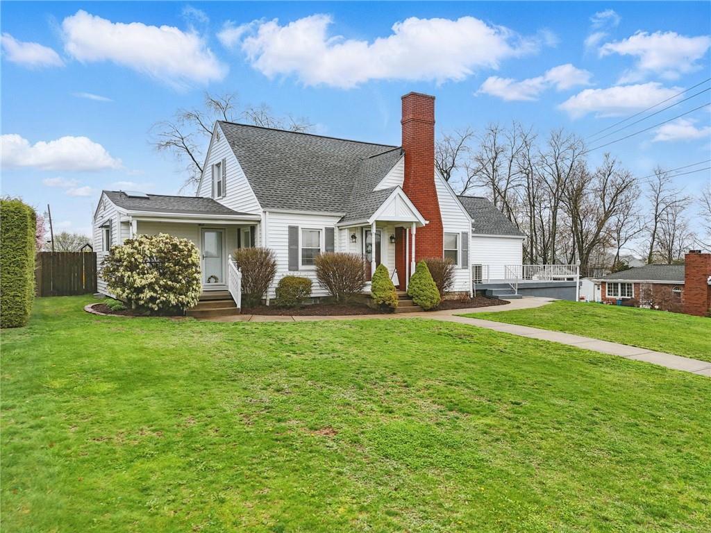 3305 Harding Avenue Aliquippa, PA 15001 - Photo 3 of 40 a front view of a house with garden
