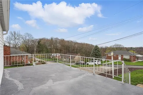 a view of a fence with a big yard