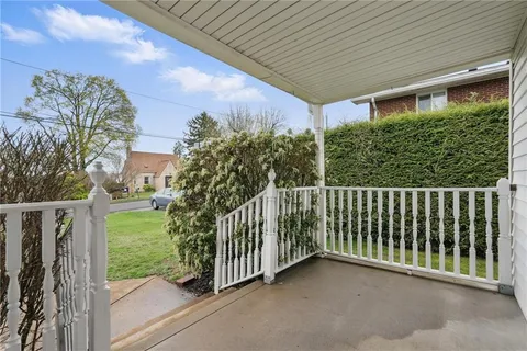 a view of a porch with a small yard