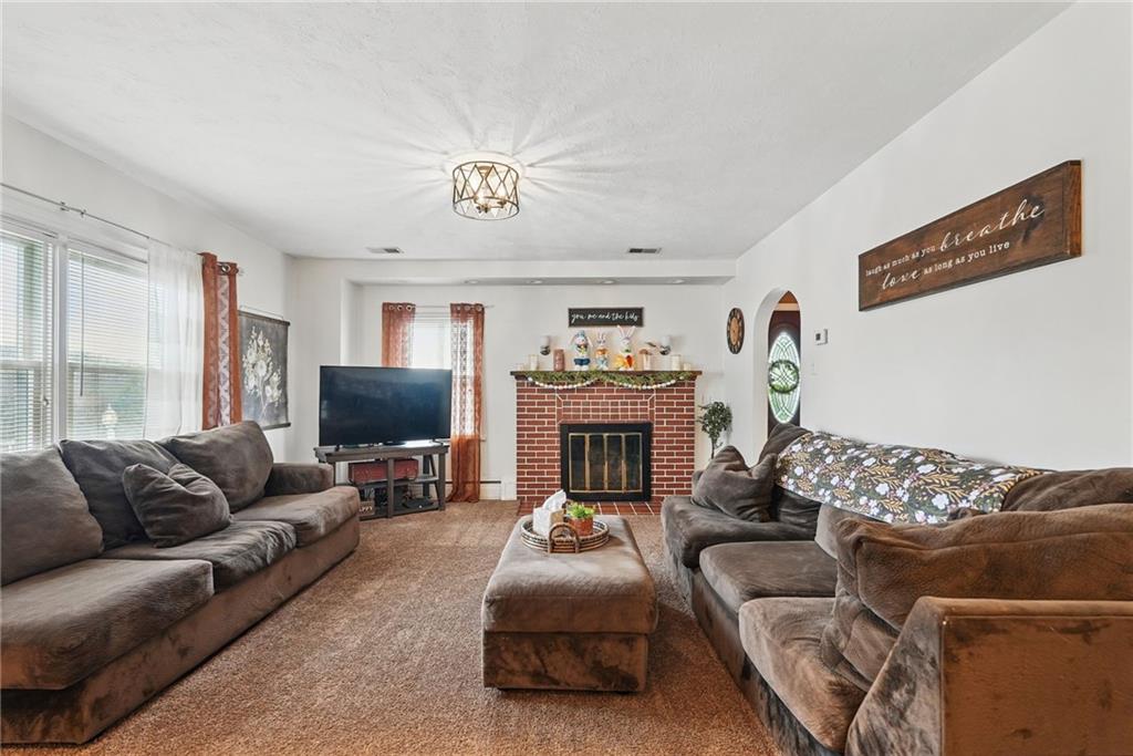 3305 Harding Avenue Aliquippa, PA 15001 - Photo 7 of 40 a living room with furniture and a fireplace