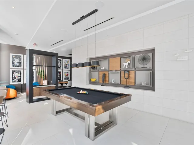 a living room with furniture and view of kitchen