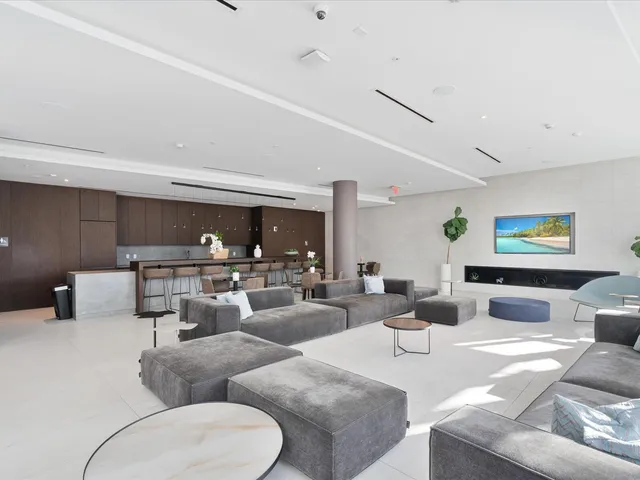 a view of a building with a umbrellas