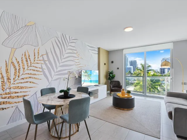 a dining room with furniture and a floor to ceiling window