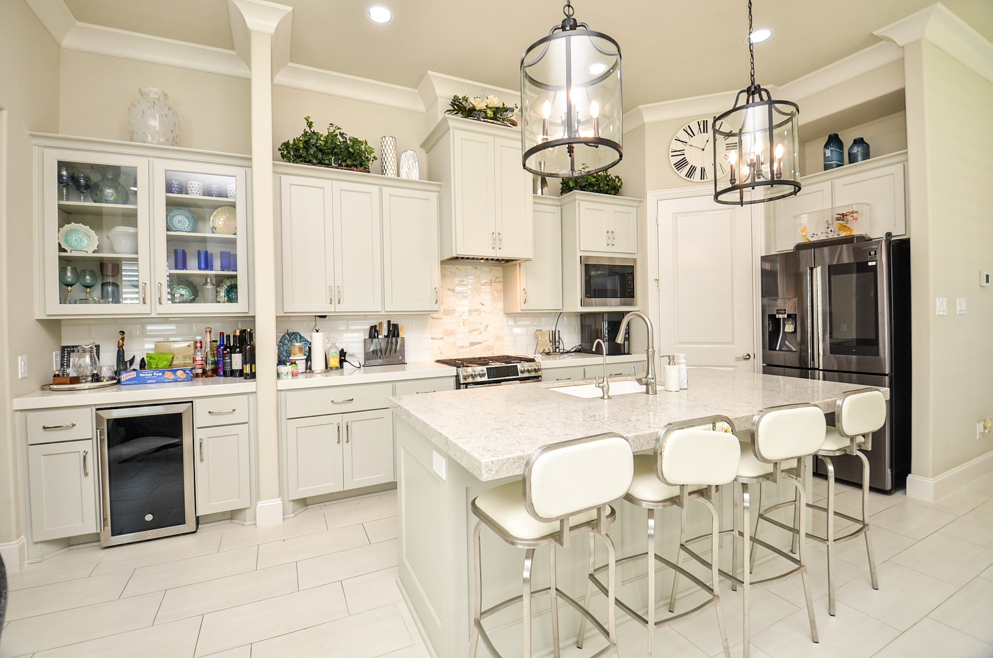 2431 Prairie Hollow Lane Houston, TX 77077 - Photo 12 of 31 a kitchen with cabinets appliances and a chandelier
