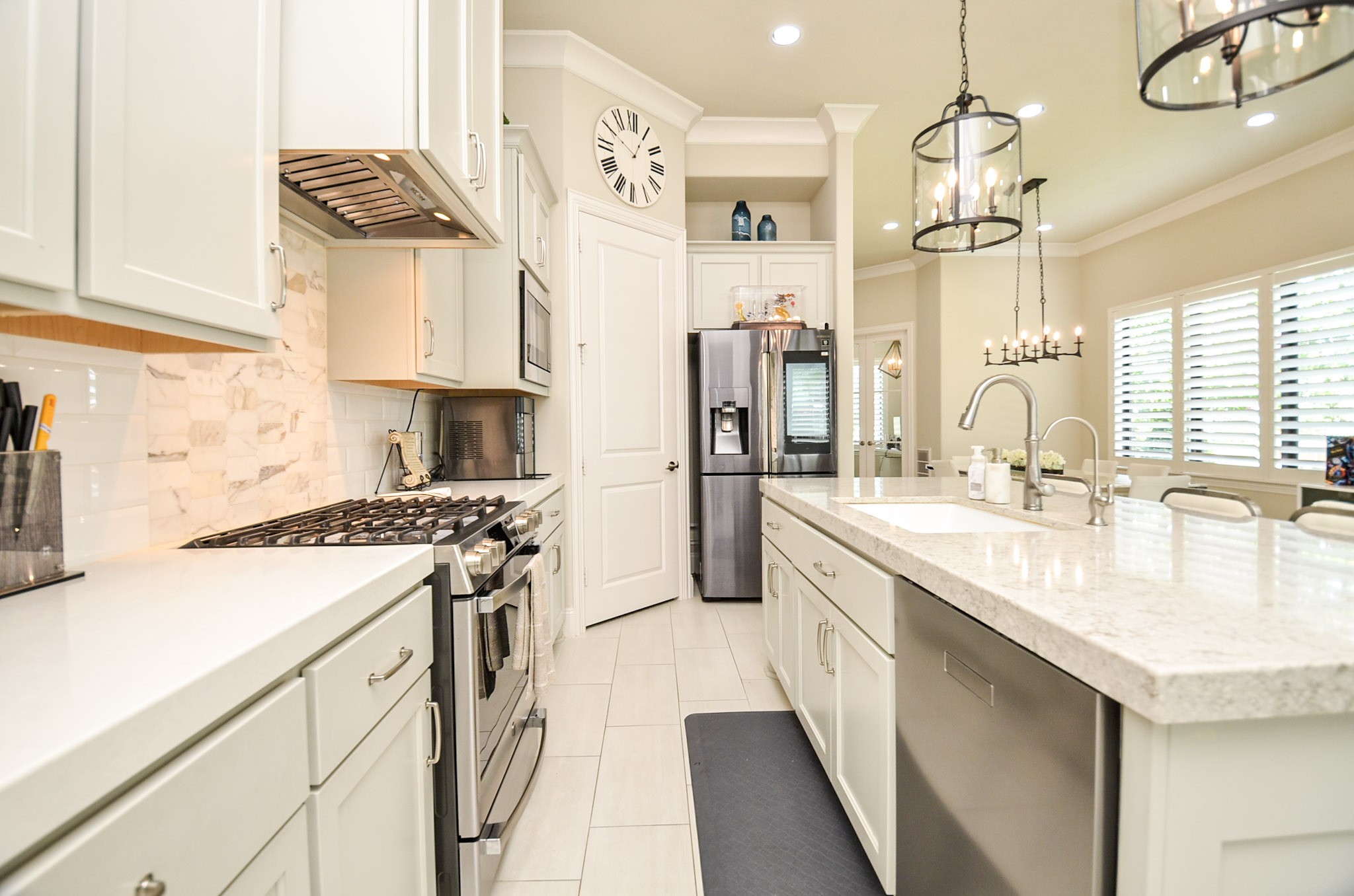 2431 Prairie Hollow Lane Houston, TX 77077 - Photo 13 of 31 a kitchen with stainless steel appliances granite countertop a sink stove and refrigerator