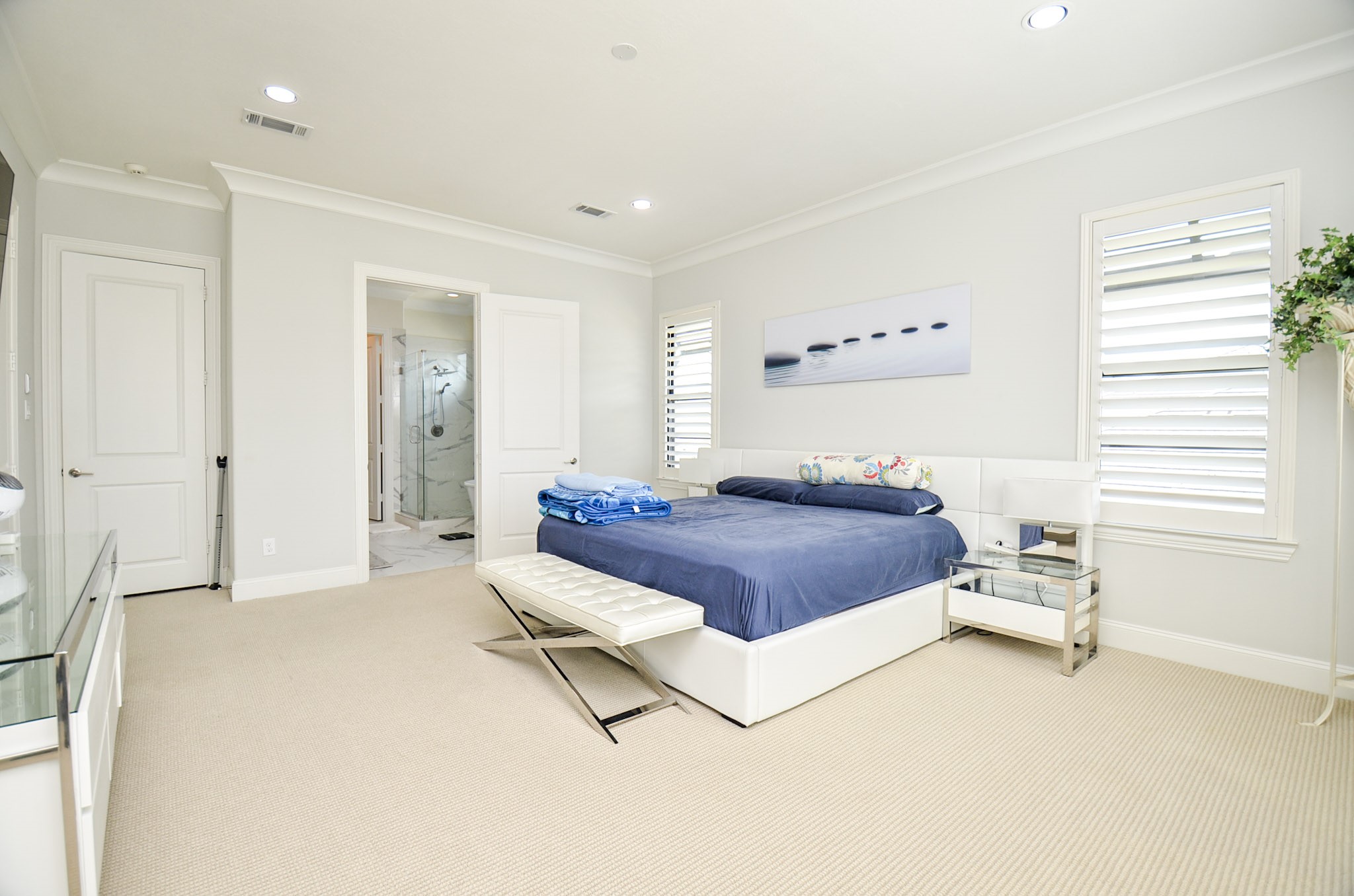 2431 Prairie Hollow Lane Houston, TX 77077 - Photo 19 of 31 a bedroom with a bed and a cabinets