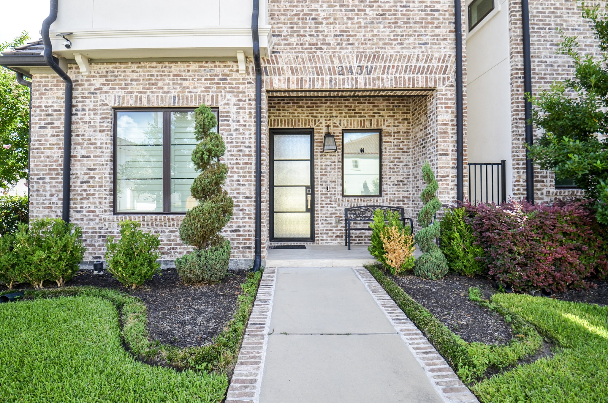 2431 Prairie Hollow Lane Houston, TX 77077 - Photo 2 of 31 a front view of a house with a porch
