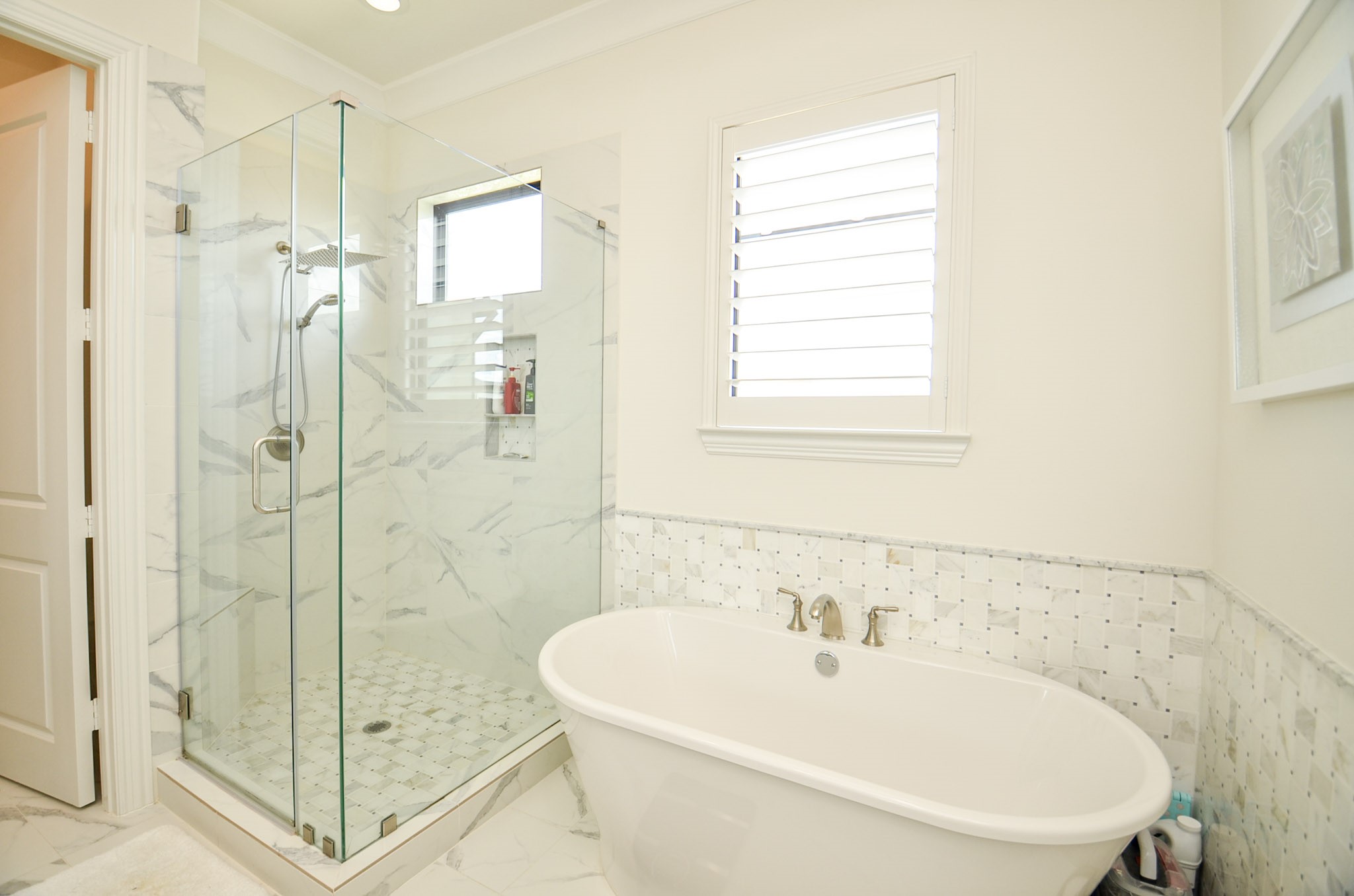 2431 Prairie Hollow Lane Houston, TX 77077 - Photo 21 of 31 a bathroom with a bathtub and a shower