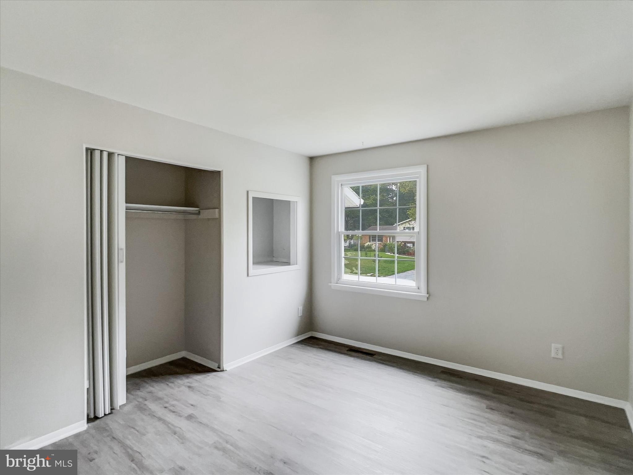 2618 Jonathan Road Ellicott City, MD 21042 - Photo 15 of 32 an empty room with windows and closet
