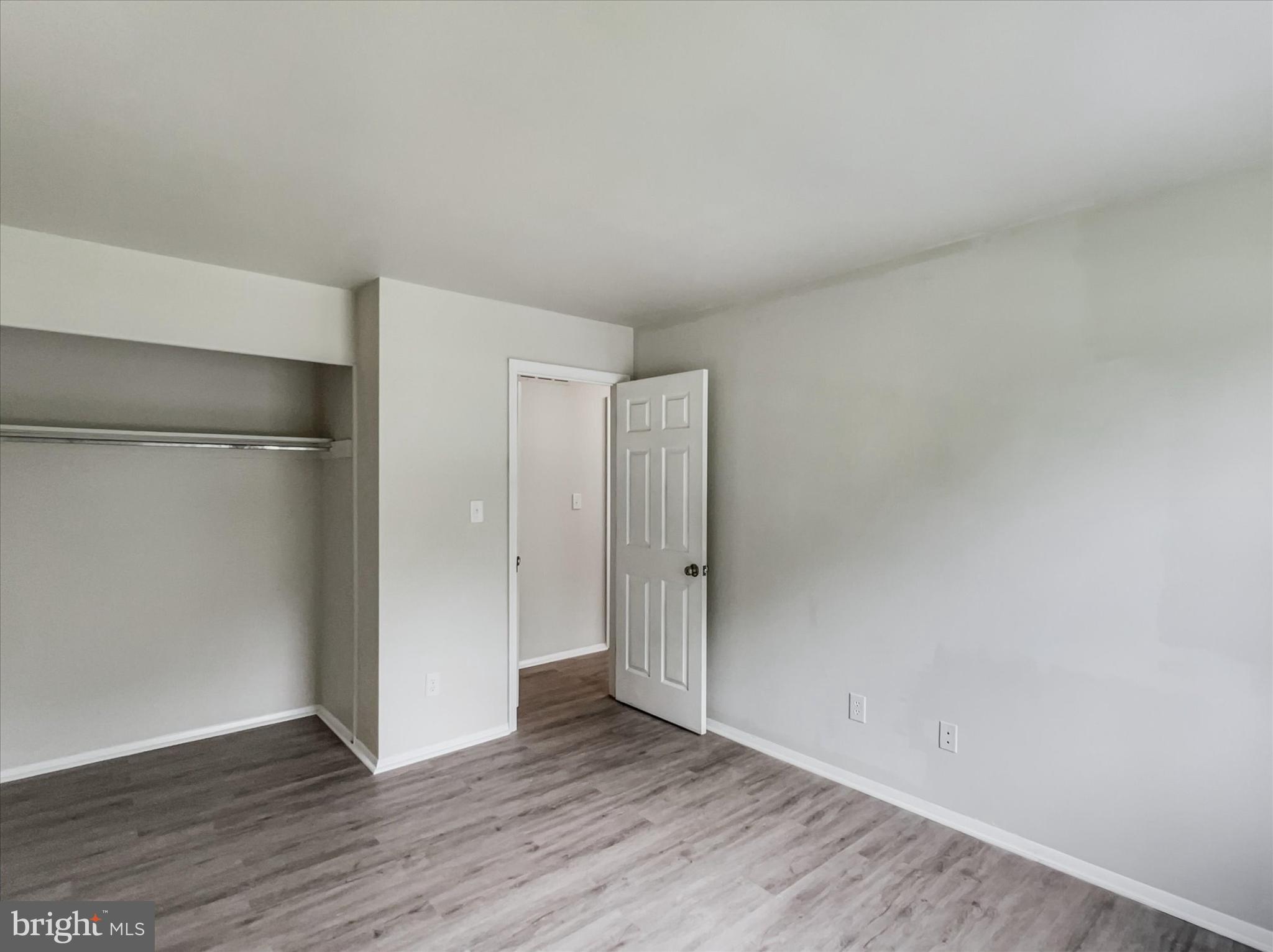 2618 Jonathan Road Ellicott City, MD 21042 - Photo 16 of 32 a view of an empty room with wooden floor
