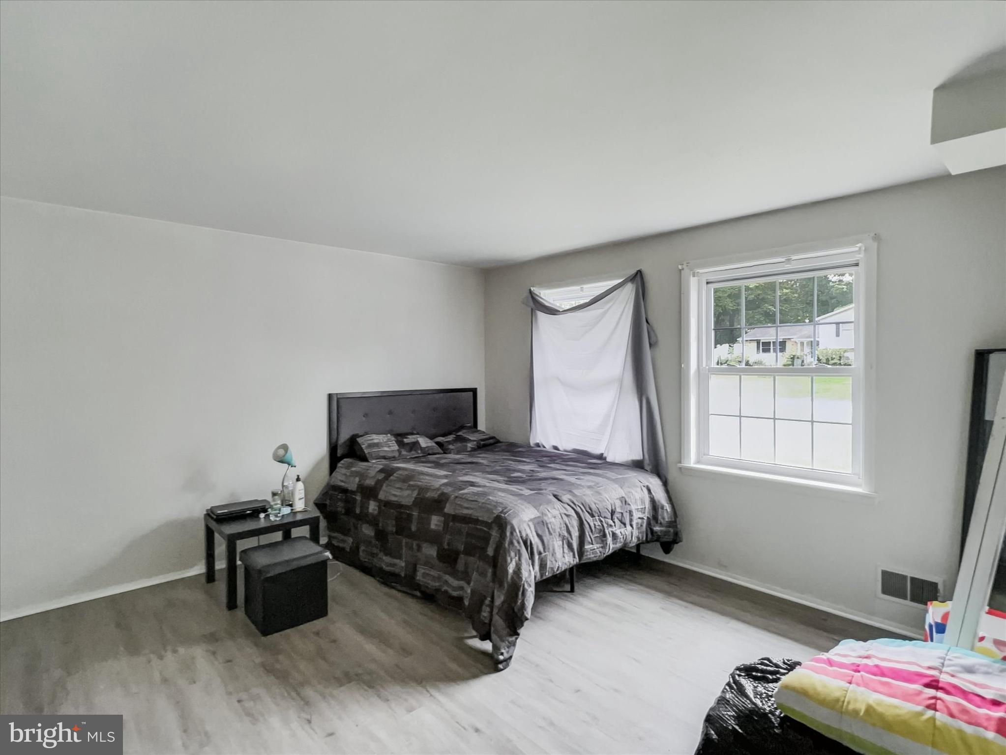 2618 Jonathan Road Ellicott City, MD 21042 - Photo 19 of 32 a bedroom with a bed and a window