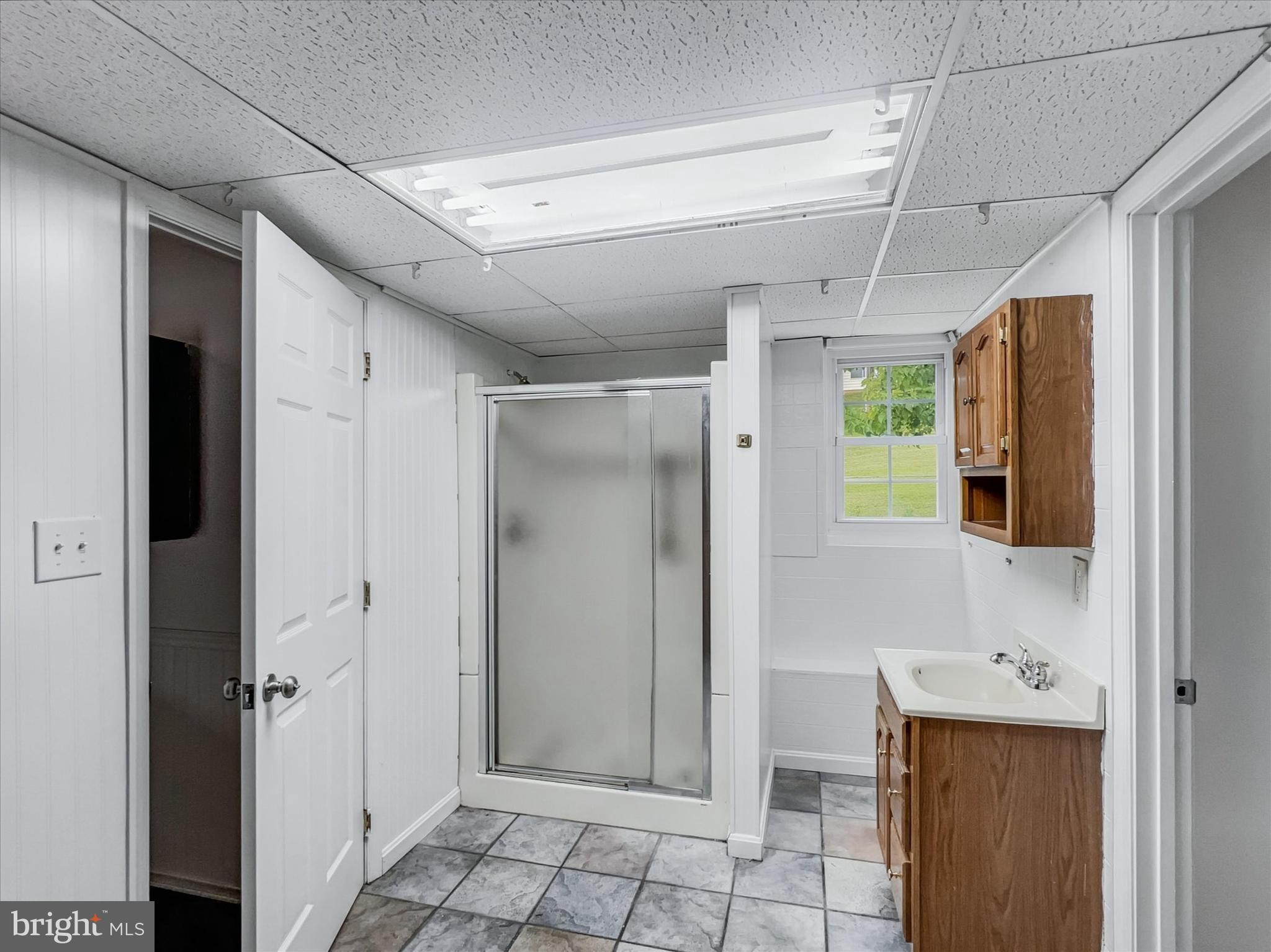 2618 Jonathan Road Ellicott City, MD 21042 - Photo 25 of 32 a bathroom with a shower and a sink