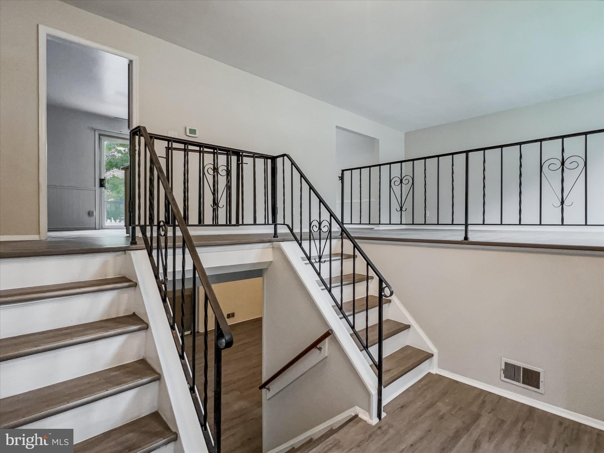 2618 Jonathan Road Ellicott City, MD 21042 - Photo 3 of 32 a view of staircase with wooden floor and a view of a staircase