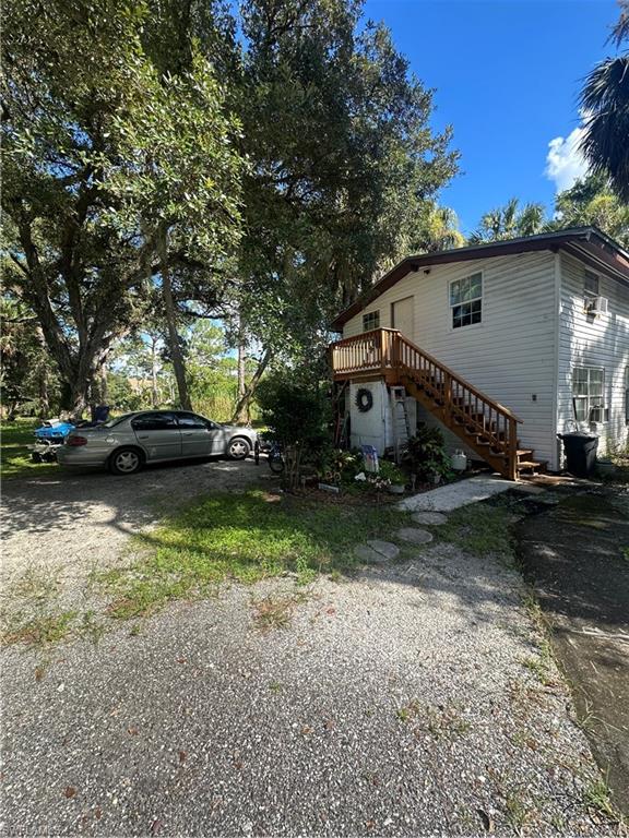 18301 Slater Road North Fort Myers, FL 33917 - Photo 11 of 17 a view of a house with a yard