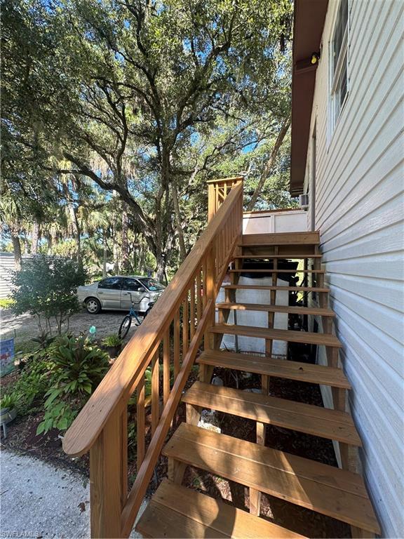 18301 Slater Road North Fort Myers, FL 33917 - Photo 16 of 17 a view of entryway with wooden floor and fence