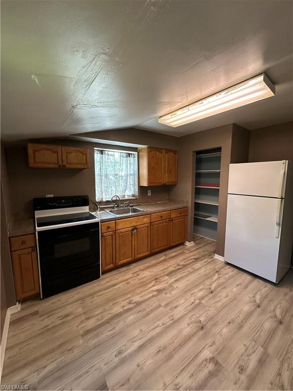 18301 Slater Road North Fort Myers, FL 33917 - Photo 3 of 17 a large kitchen with a stove and a refrigerator