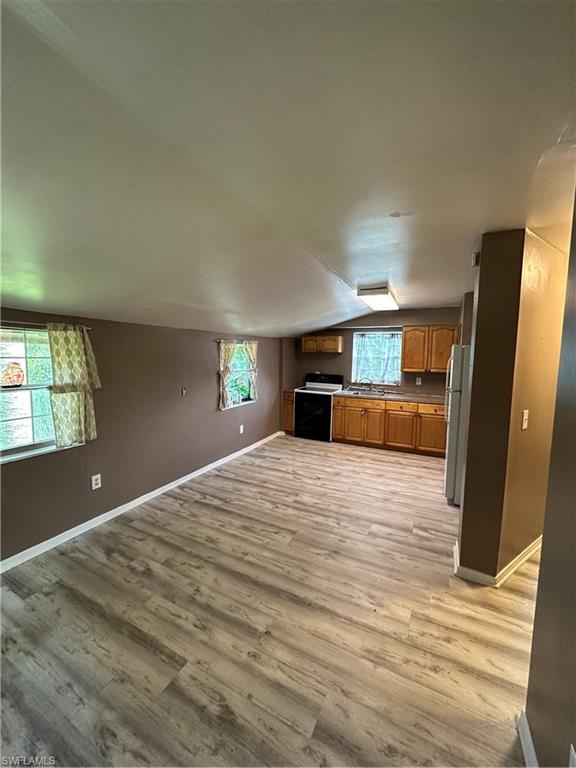 18301 Slater Road North Fort Myers, FL 33917 - Photo 5 of 17 a bedroom with a large bed and large window